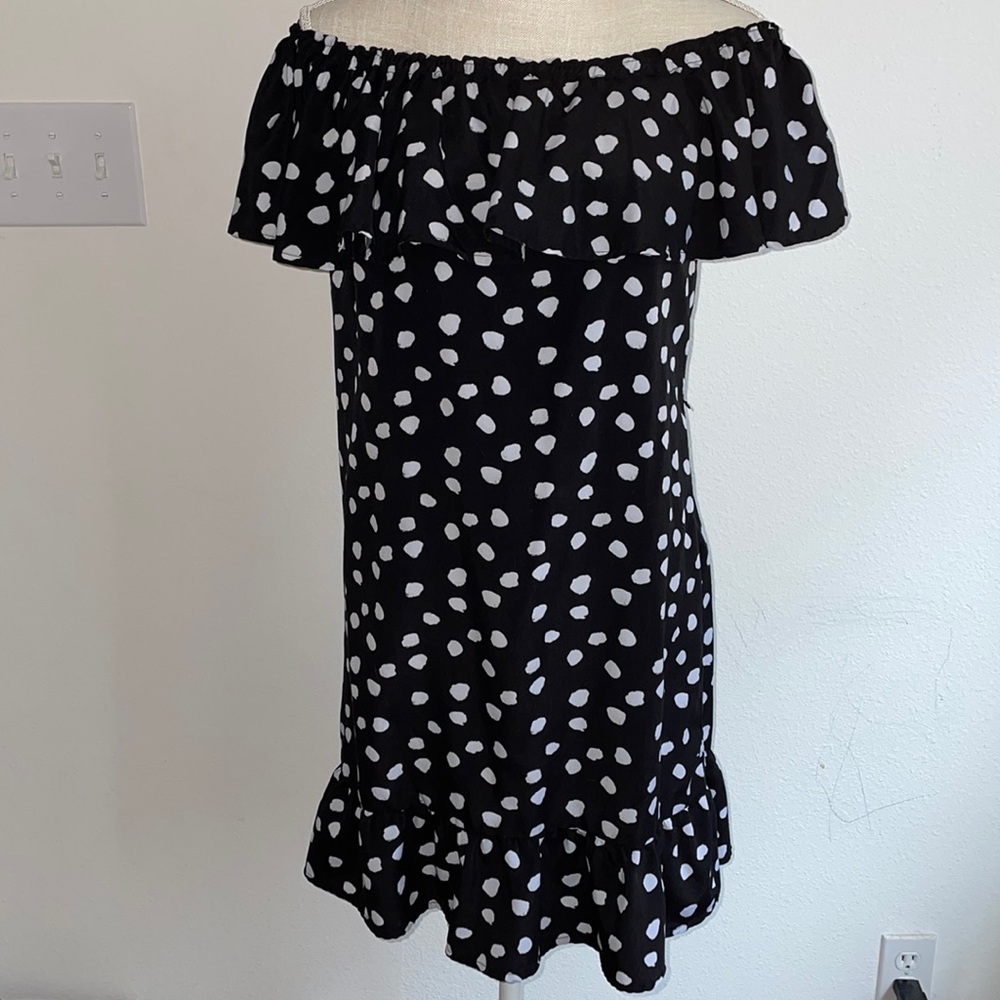 Off the shoulder black and white dress.